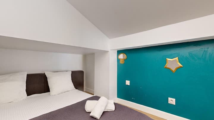 Cosy bedroom with blue wall