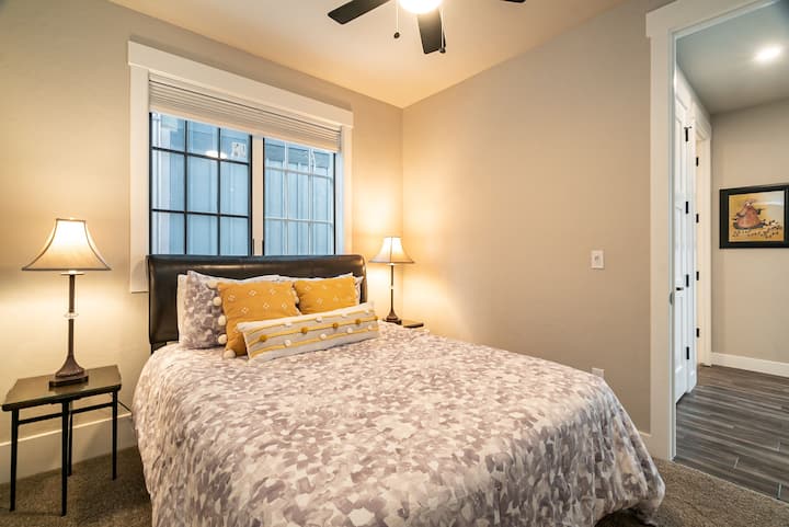 - Cozy and quiet, this guest suite features soft bedding, golden accents, and gentle lighting
- Convenient ensuite access offers added privacy and ease for every guest
- Thoughtfully styled for restful nights and peaceful morning routines
