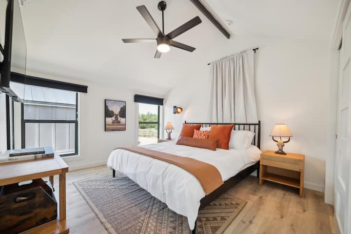 Bedroom 2: King bed, closet space, record player, smart TV