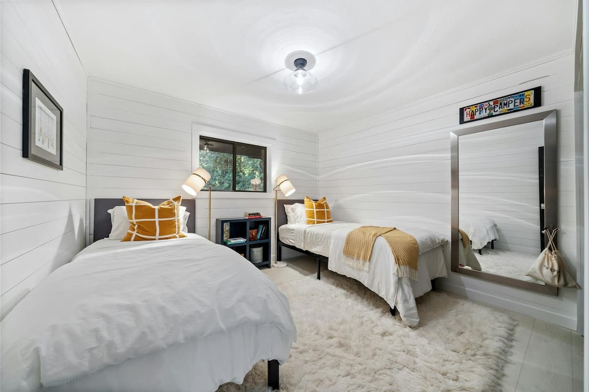 A charming space for kids or adults alike, with two twin beds and forest-inspired design.