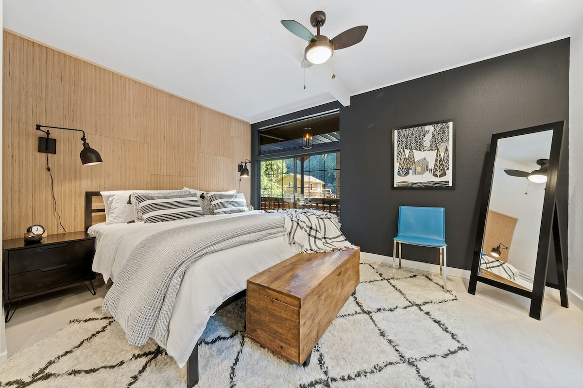 The primary bedroom features a king-sized bed with plush linens and beautiful surroundings. The master bedroom is the only bedroom on this level. 