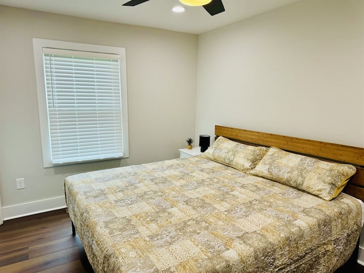Bedroom 3 with Nectar King bed mattress, ample closet, 43 in Smart TV and desk/desk chair.