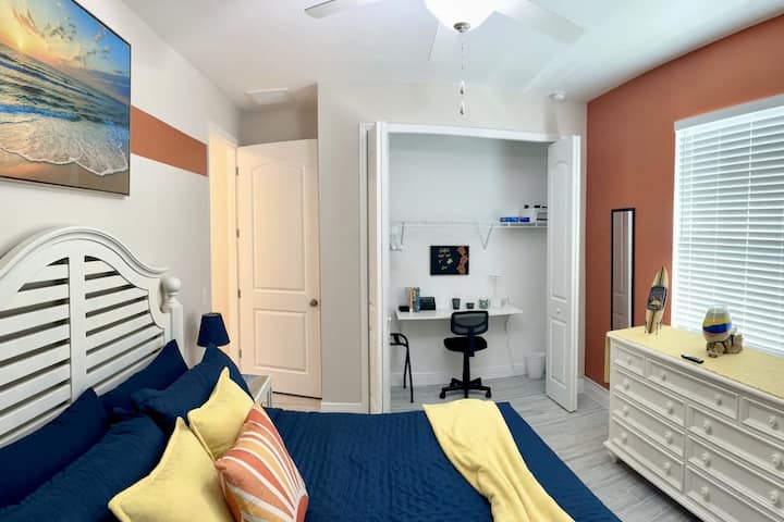 King Bedroom: Wake up to vibrant colors and serene art, with a workspace for your adventures!