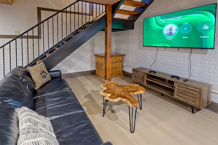 Comfortable hangout space featuring an Xbox and large TV.