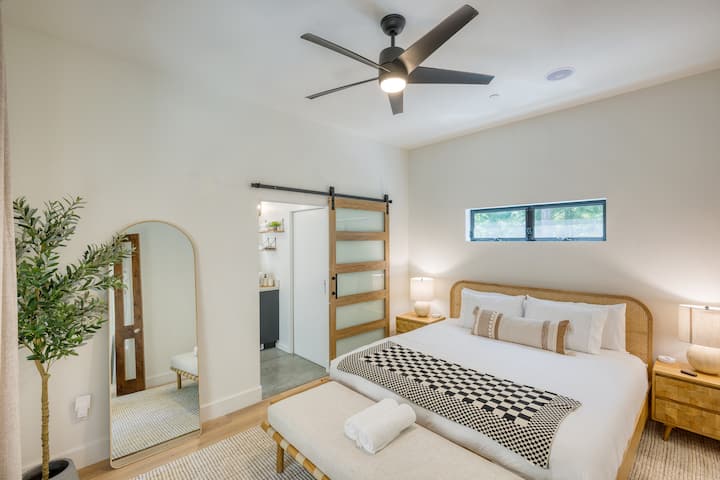 Primary bedroom features a king bed and an ensuite bathroom.