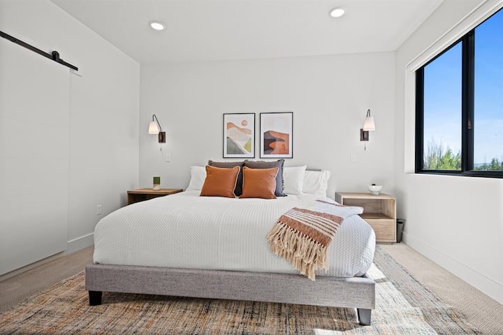 Primary bedroom ensuite with king bed and TV (not shown).