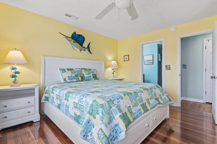 The primary bedroom comes outfitted with a king bed, bathroom, and its own balcony.