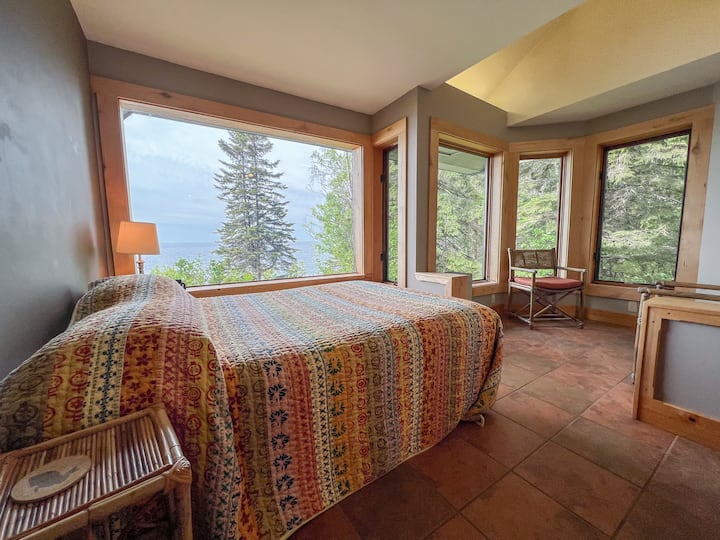 The first bedroom has beautiful bay windows.
