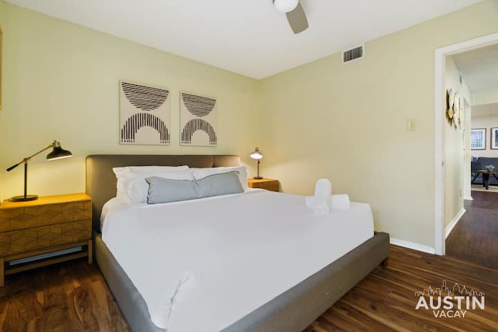 King bedroom on the first floor with luxury linens and bathroom