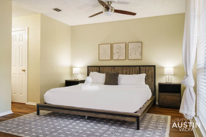 Upstairs king bedroom with luxury linens, bathroom, and closet