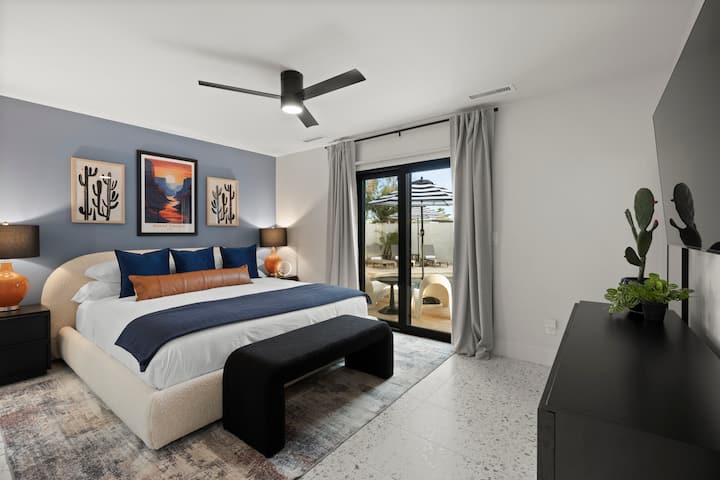 Elegant bedroom with a king bed and direct access to the patio.