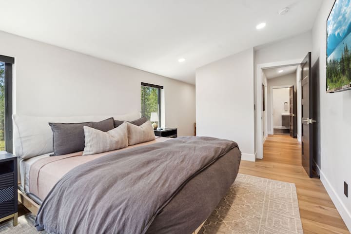 The primary bedroom opens up into the enjoying hallway which leads into the laundry room and primary bathroom.