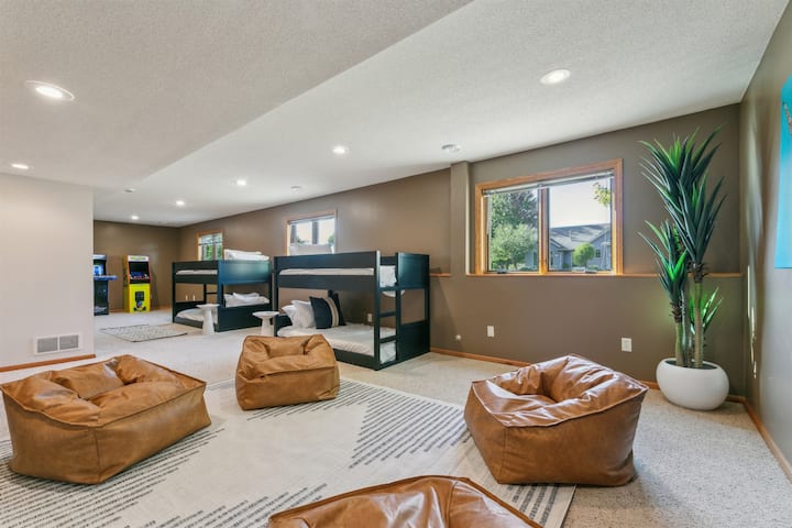 Huge Bunk Room for the kids with plenty of space to play. Moveable leather beanbags in front of a 70" TV & Pacman and NFL Blitz arcade games.