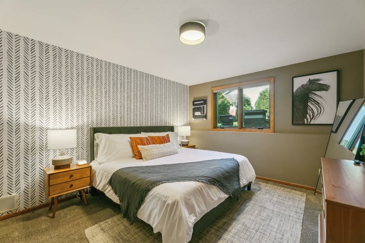 King Bedroom with large Smart TV and designer finishes.