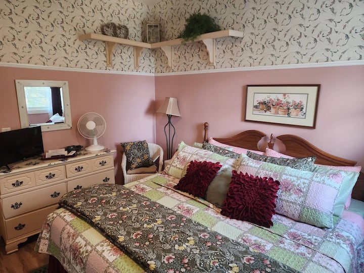The primary bedroom is upstairs and features a king sized bed.