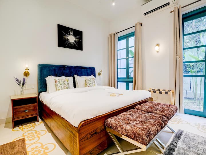 • Modern Cozy Bedroom with Elegant Upholstered Bed Design
• Bright Interior with Large Windows & Soft Natural Light
• Stylish Décor with Contemporary Furnishings & Warm Ambience
• Comfortable Bedroom Space Perfect for Relaxation & Peaceful Stay