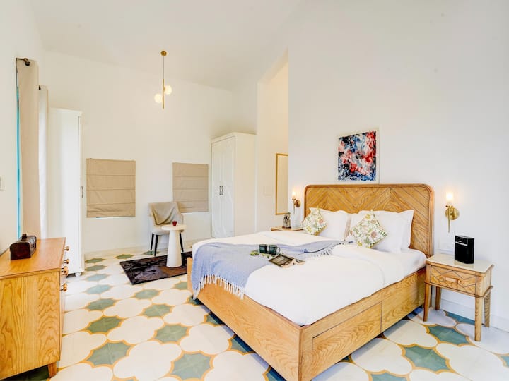 • Cozy Modern Bedroom with Elegant Interior Design
• Bright Space with Large Windows & Natural Light
• Comfortable Bed Setup with Warm & Relaxing Ambience
• Perfect Bedroom for Peaceful Stay & Comfortable Living