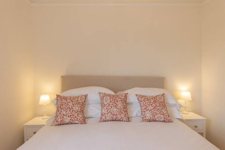 Double bedroom with bedside tables and lamps.  Skylark is available with Durrants Holiday Cottages, Southwold