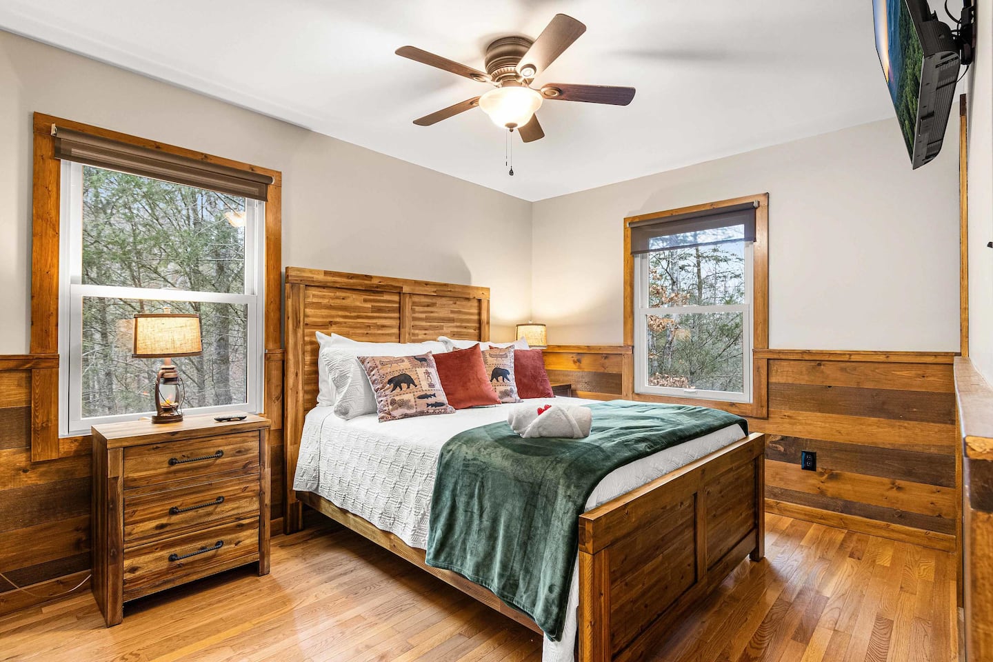Guest Bedroom 1 — queen bed, forest-view windows