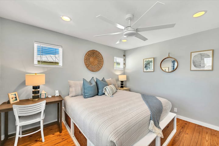 Main bedroom located upstairs includes desk, ensuite bathroom, phone chargers, brand new mattress, TV, luggage rack, large closet and dresser