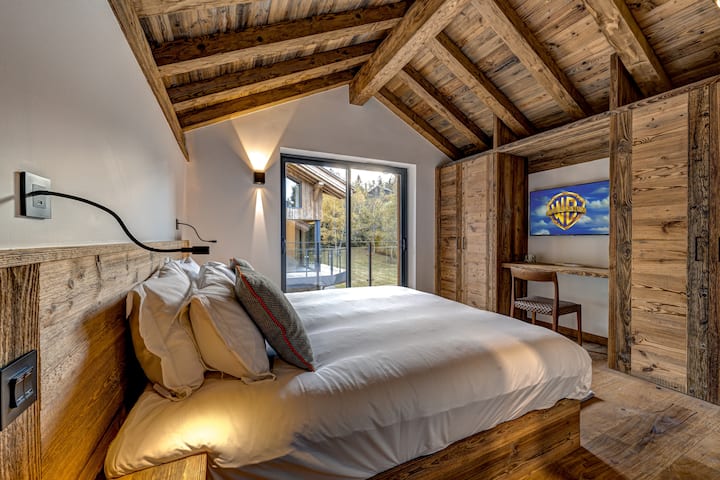 Bedroom 4 with glass doors onto balcony 
