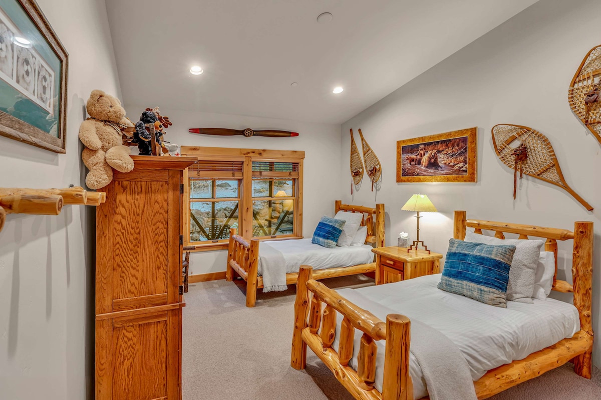 Bedroom 3:  2 twin beds, 1 chair, armoire, 32” Smart TV, main floor