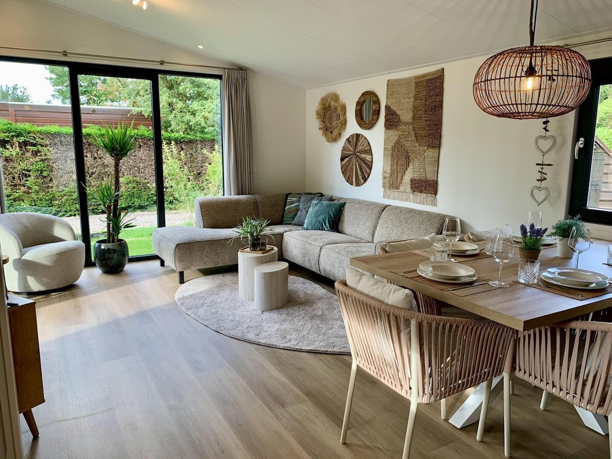 Top Airbnb: Luxury chalet on park with pool, beach nearby in Sint Maartensvlotbrug West