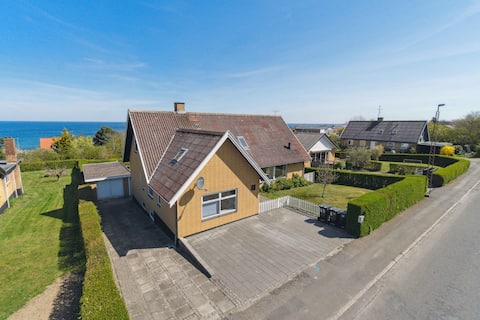 Modern holiday home with sea view in Tejn