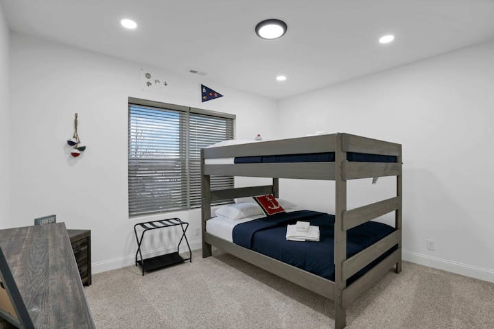 The queen-over-queen bunk bed is ideal for extra guests, with a bathroom shared with Bedroom 3, offering both comfort and convenience for your stay.