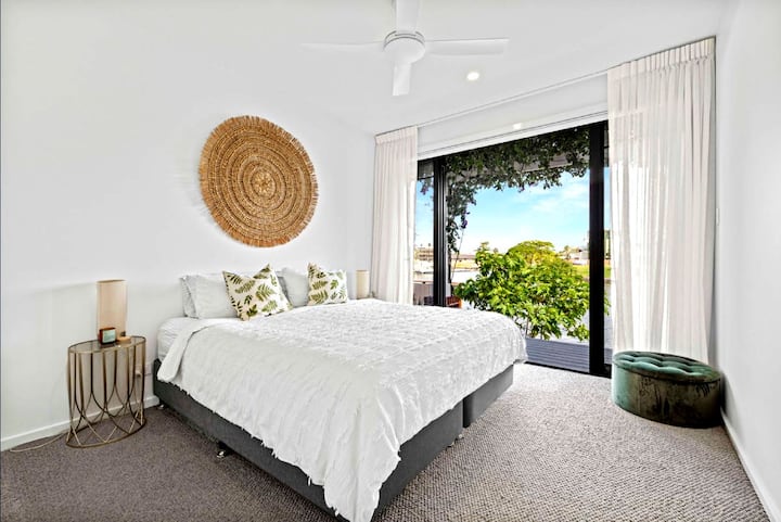 Sink into plush bedding and enjoy peaceful canal views from every corner of this elegant retreat.