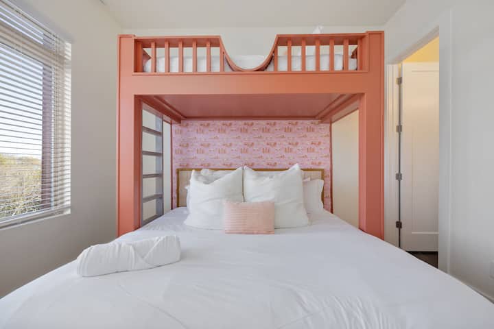 Roomy primary bedroom with a twin bunk over a king bed - The Pink Stetson - Nashville, TN