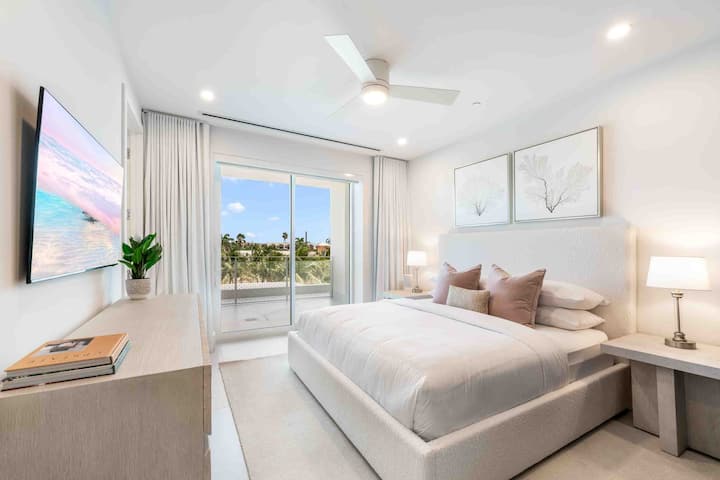 Bedroom 3 features a king bed, SmartTV, and walkout access to a land-side balcony. 