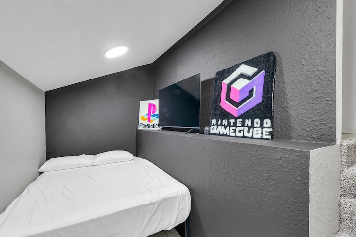 Behind the kitchen find a secret bunker bedroom with a PS2 console