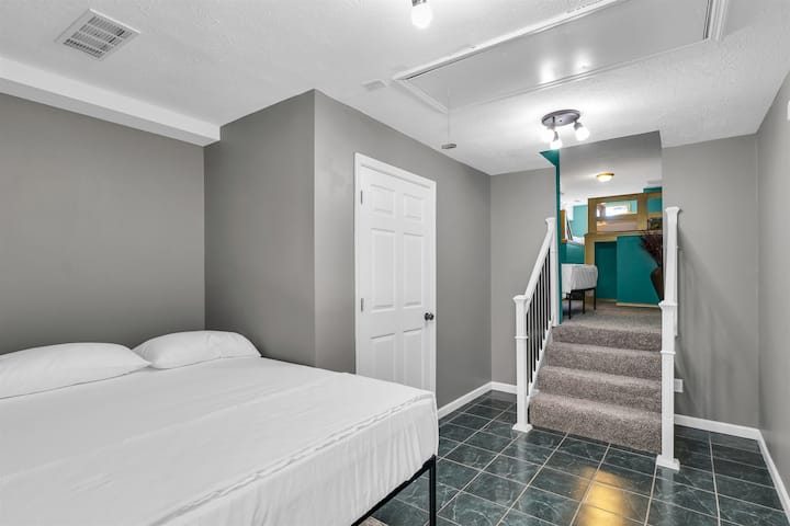 A queen bed on the lower level gives a bit more separation from the castle room fun