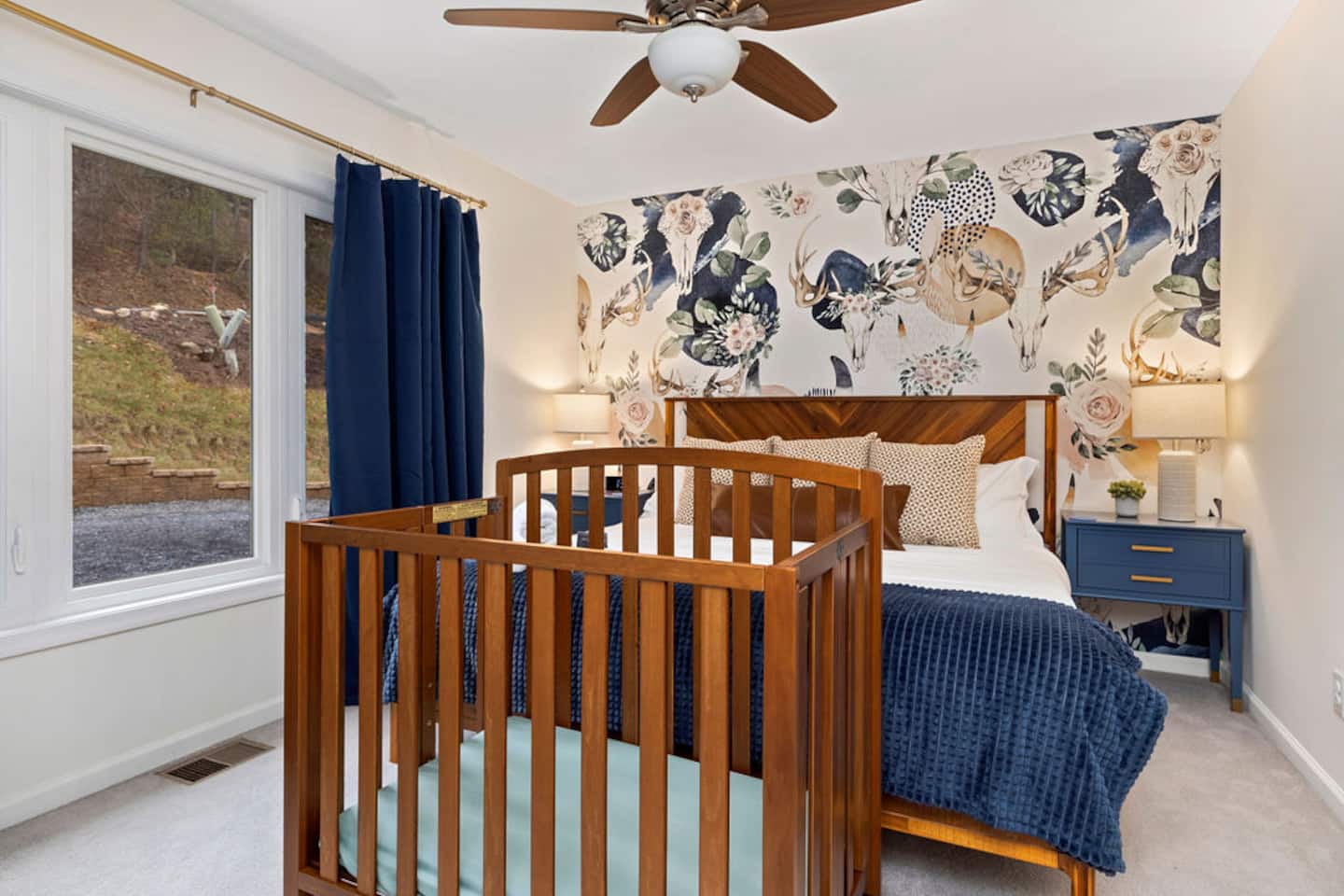 Bring the baby and don't give up the good room for it. The crib folds right down next to the bed, so nobody's sleeping down the hall from
