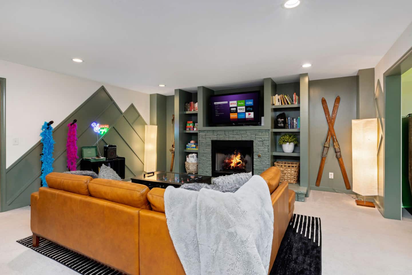 Sink into the sectional downstairs and let someone else pick the show while the fireplace runs.