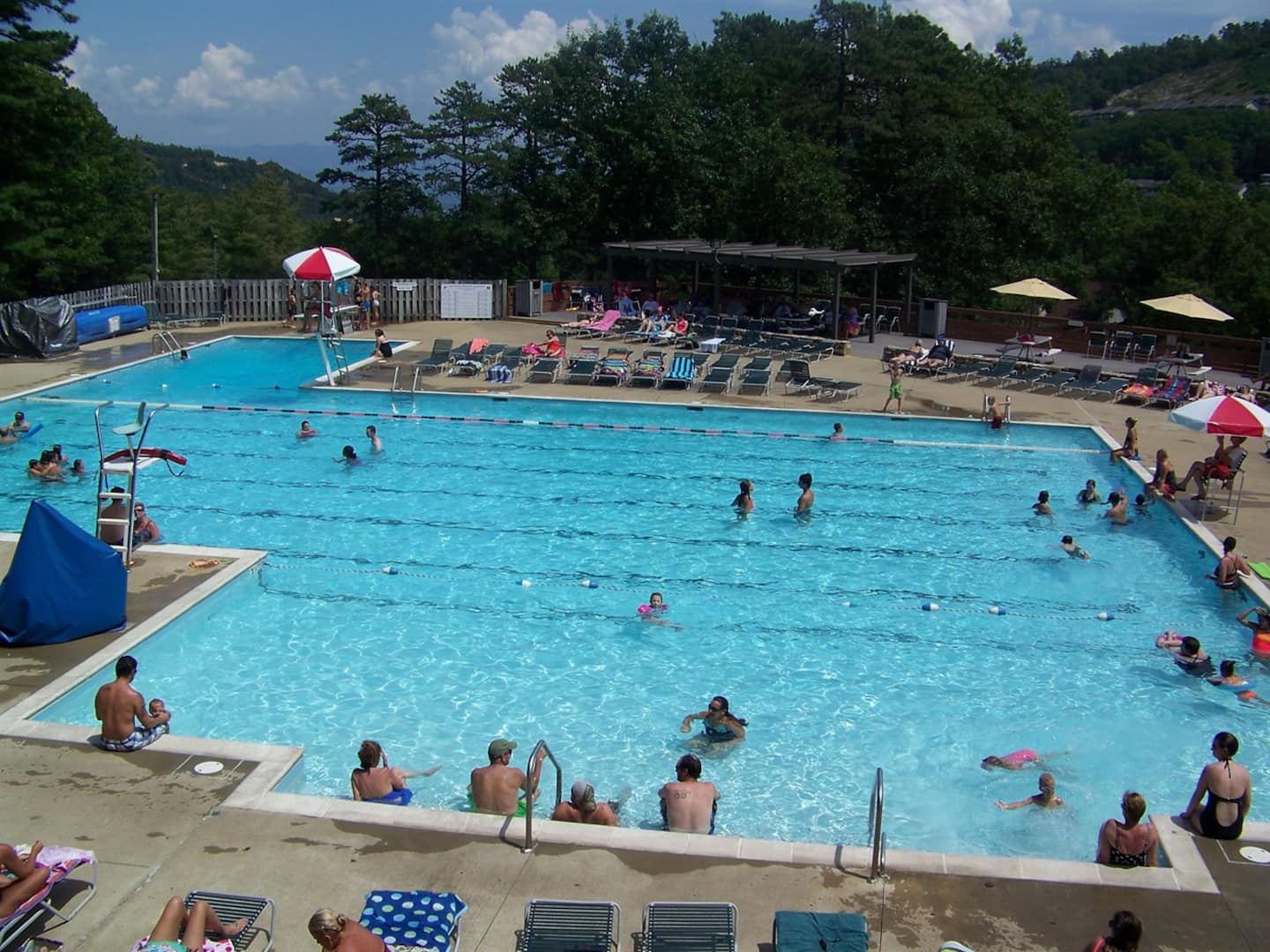 Pack the swimsuits even if the hot tub's calling louder, your stay comes with a pass to this pool. Lifeguard's on duty, lounge chairs are