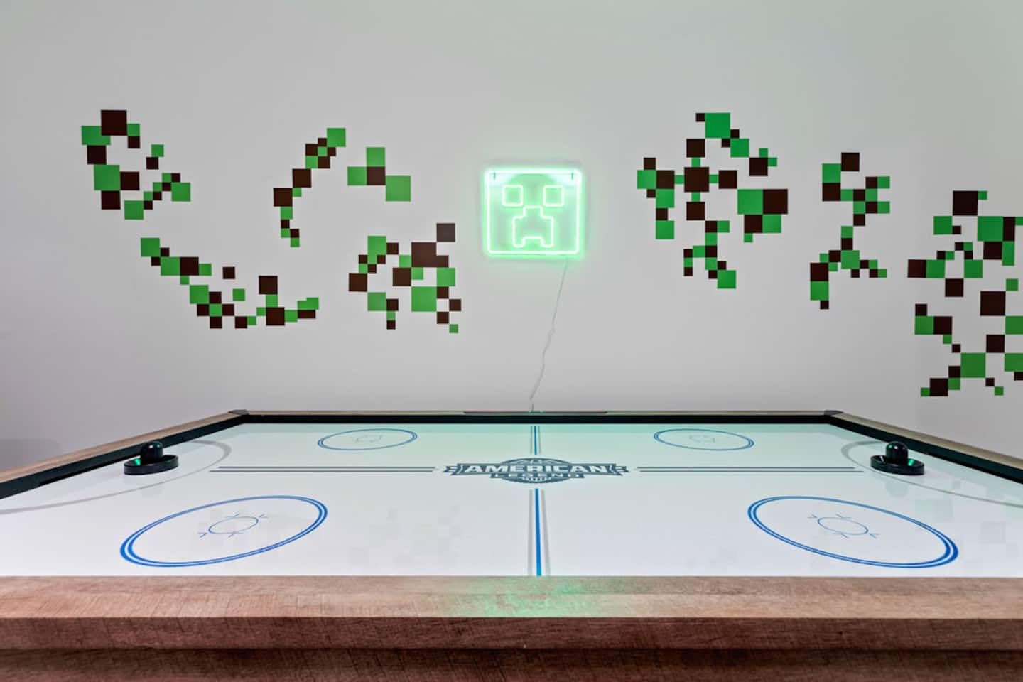 Stay up later than planned playing air hockey under the green glow of the creeper sign. It's easy to find in the dark, at least.