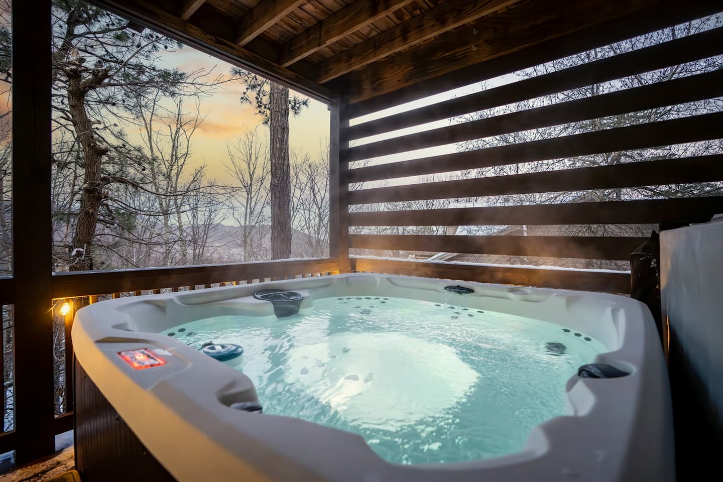 Slide into the hot tub right as the sky turns orange behind the trees