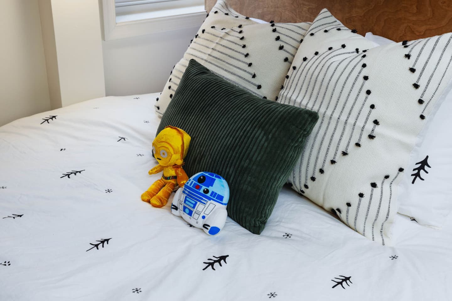 Find C-3PO and R2-D2 riding shotgun on the bunk room pillows. Somebody's taking a picture of this before bed on night one.