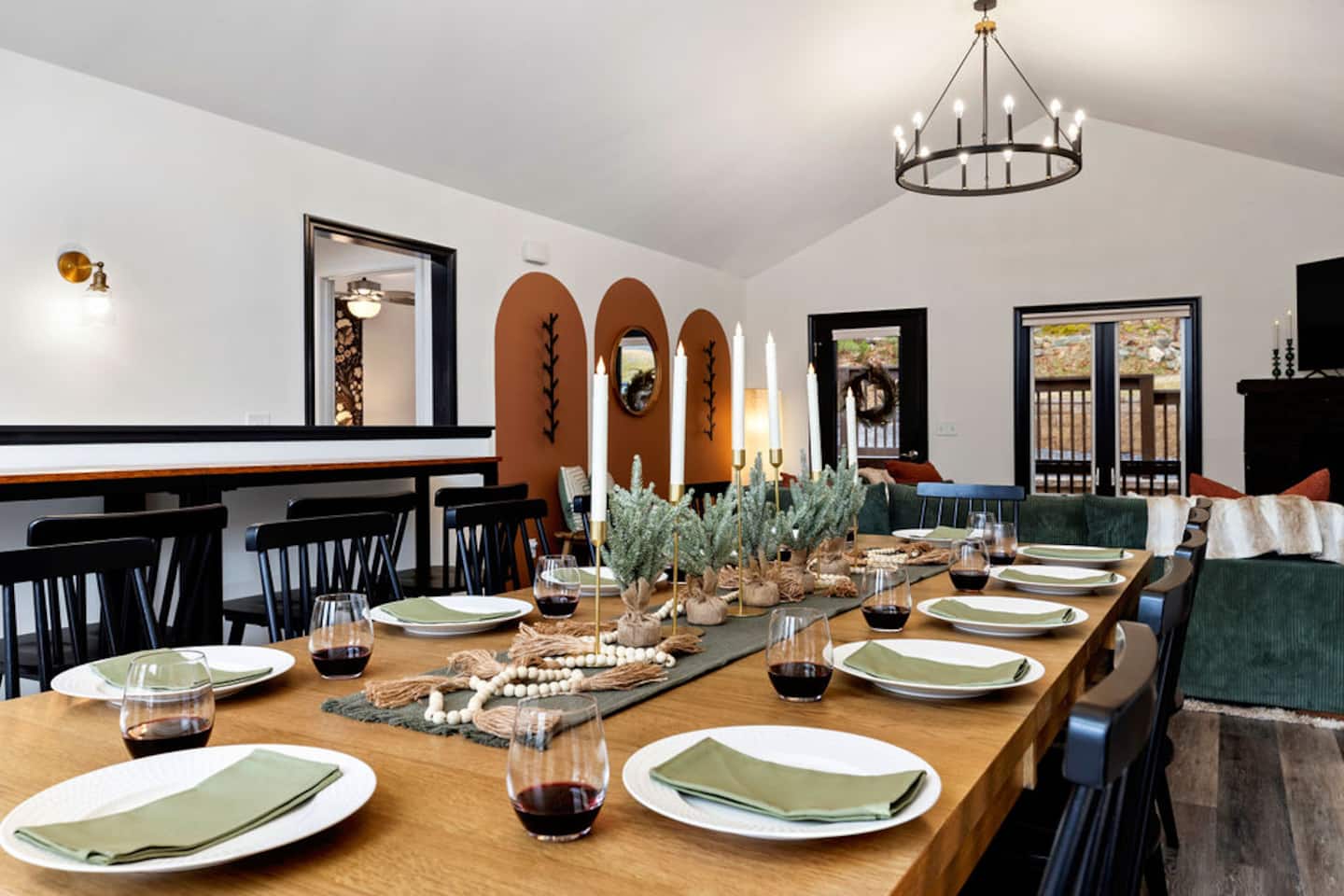 Pour the wine, light the candles, and let this table hold the whole group for at least one meal a day. It's the spot everyone ends up