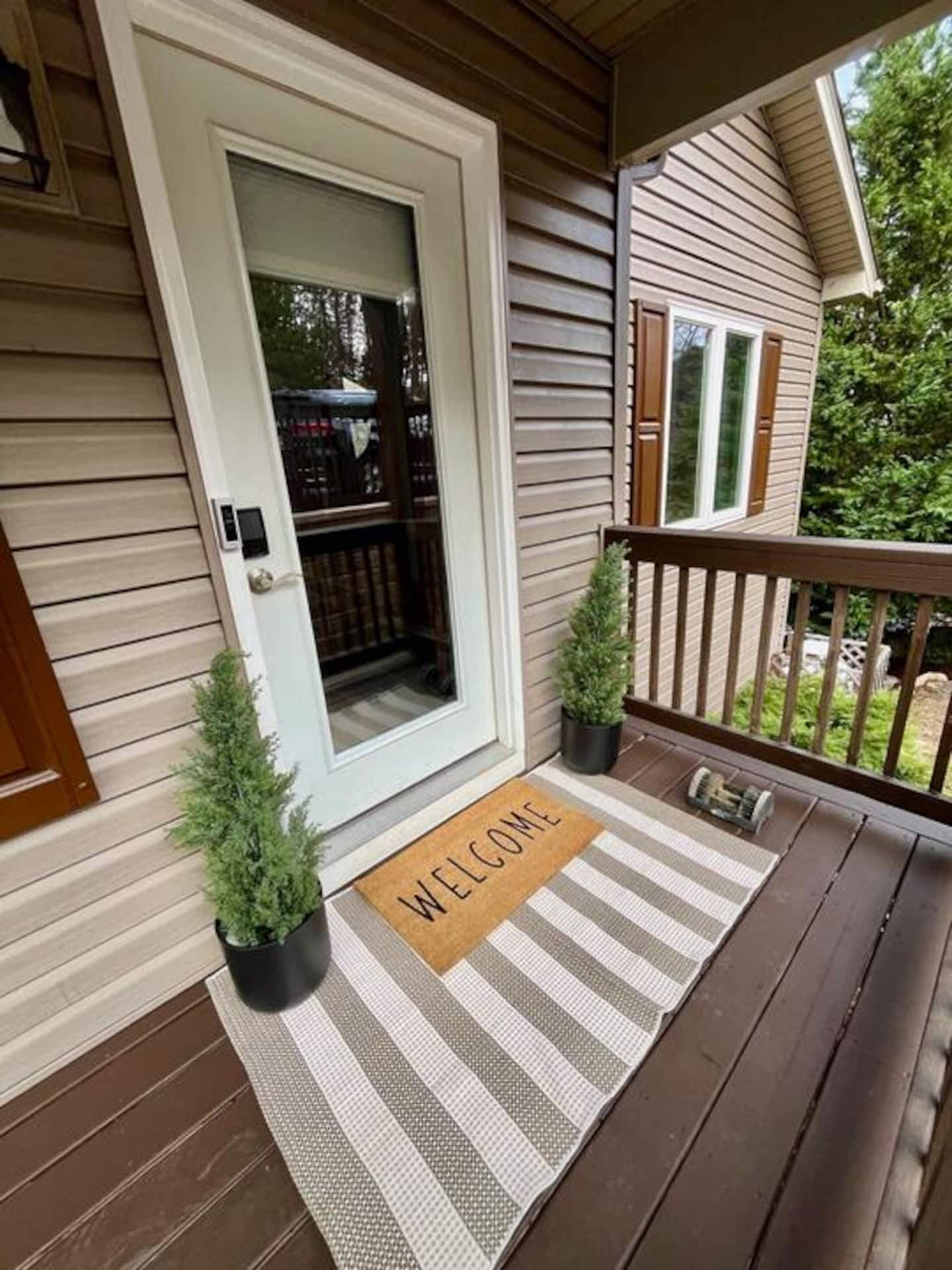Walk right through this door the second you pull in, bags and all. Two little evergreens by the entry are your first hint of what's waiting
