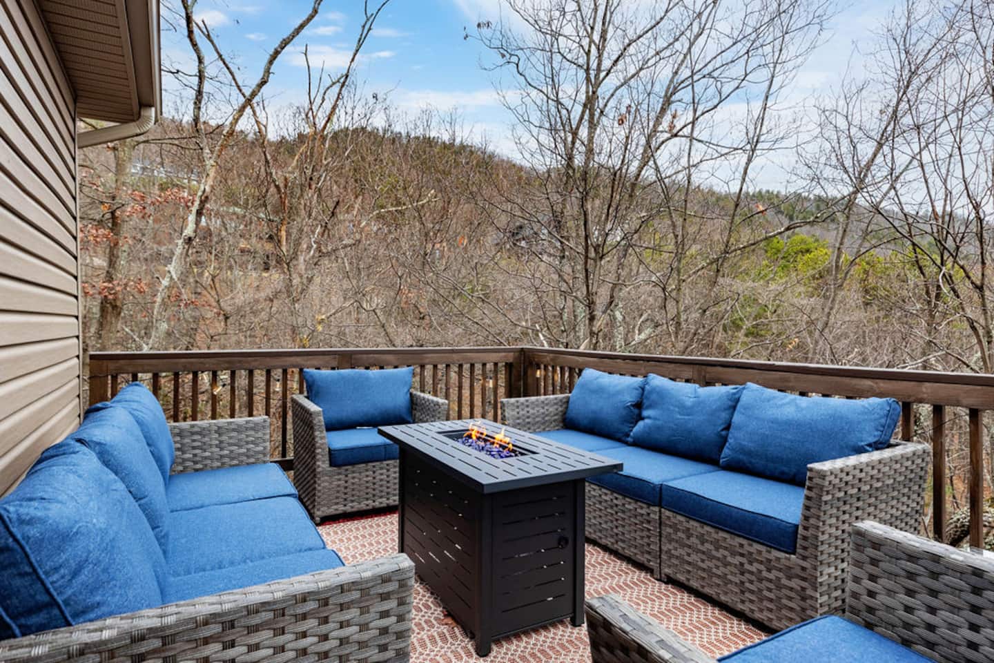 Pull a chair up to the fire pit once the sun's down. The mountain ridge fades into the dark and the conversation just keeps going.
