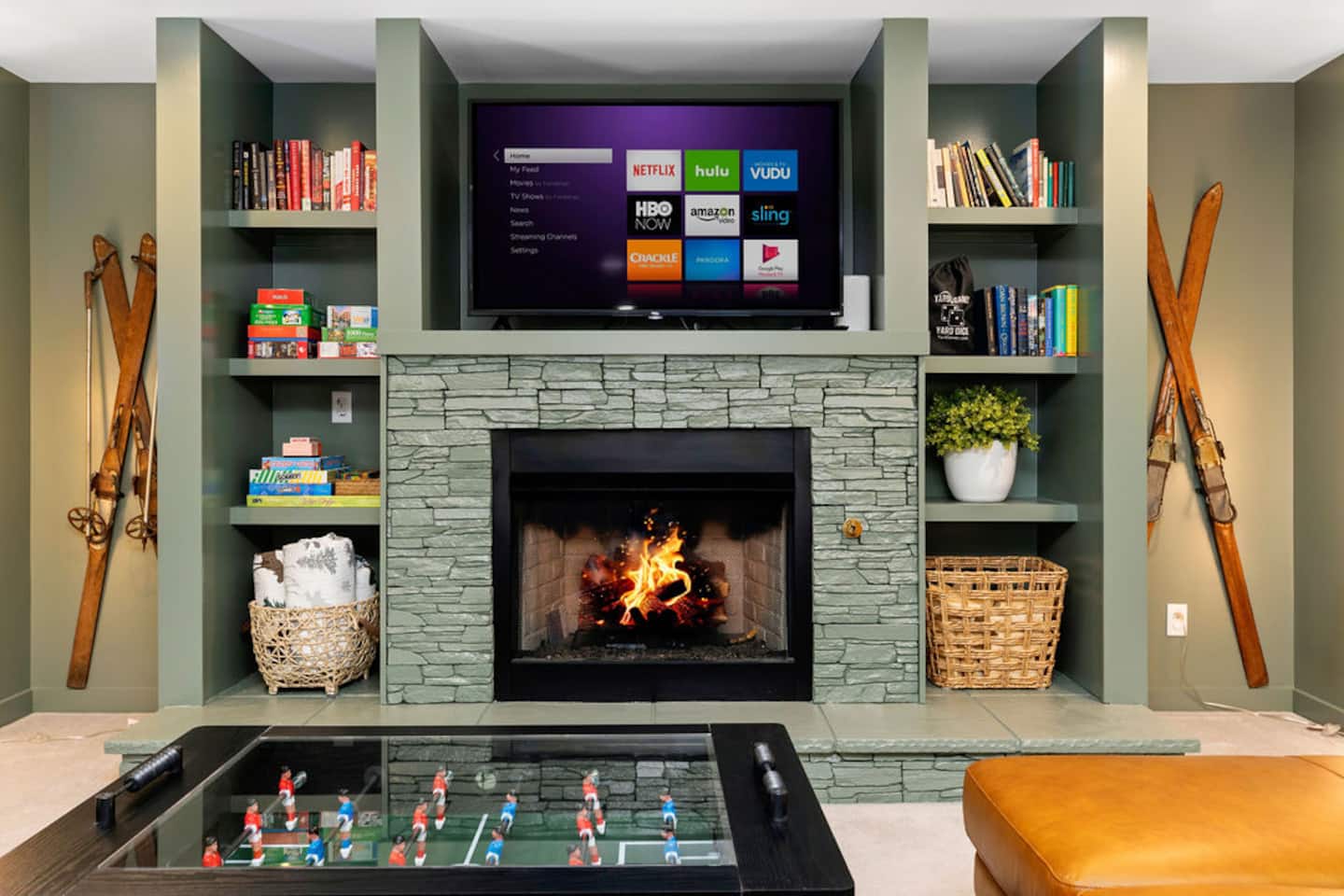 Watch whatever the group agrees on, right below the fireplace with the skis standing guard on either side. Foosball's one step away when