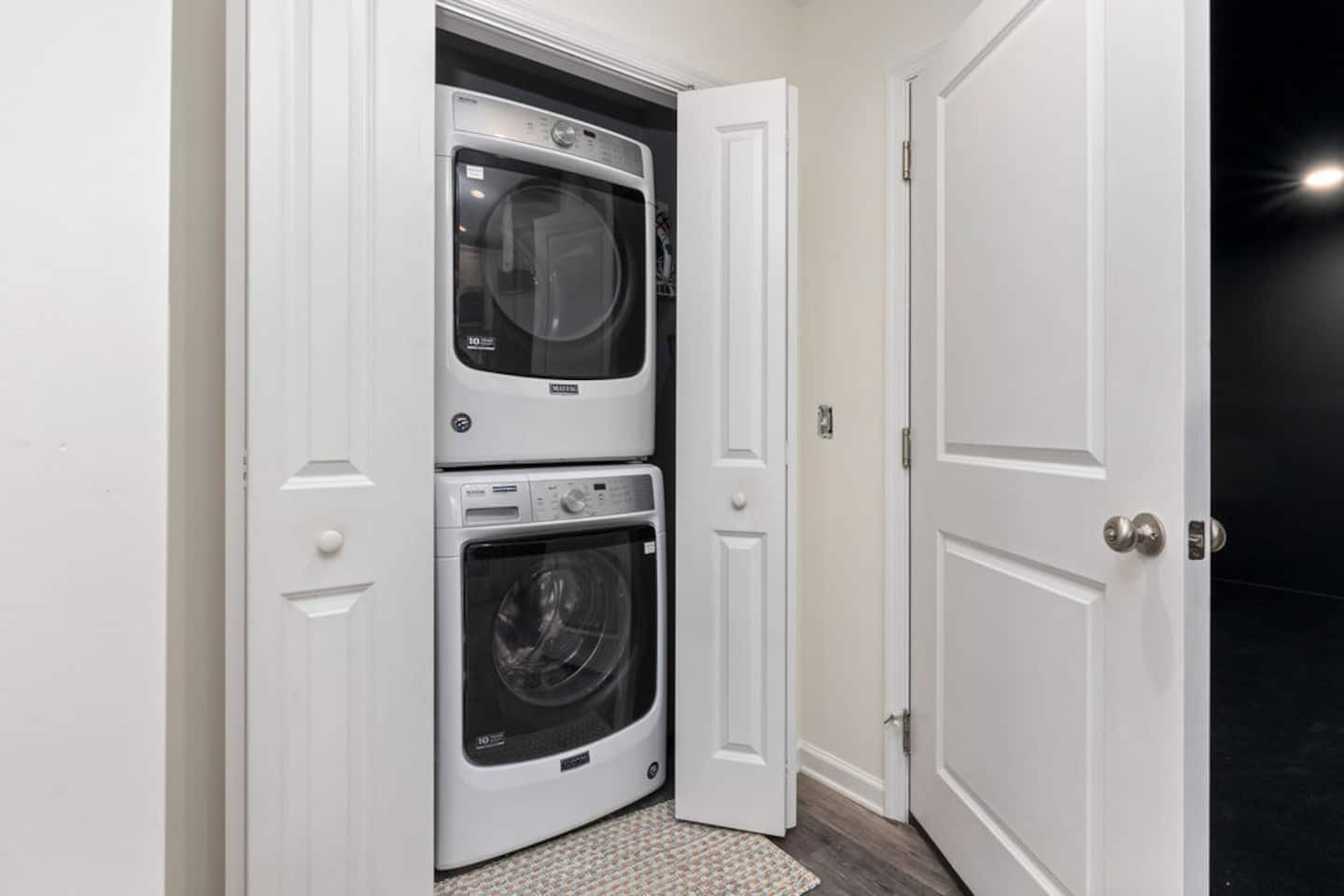 Pack light and run a load halfway through the trip instead of hauling home a suitcase of dirty clothes. It's tucked right off the kitchen,