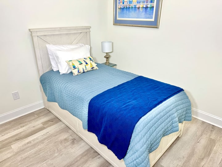 Twin trundle bed with blackout curtains. Linens for bottom twin trundle bed in closet. 