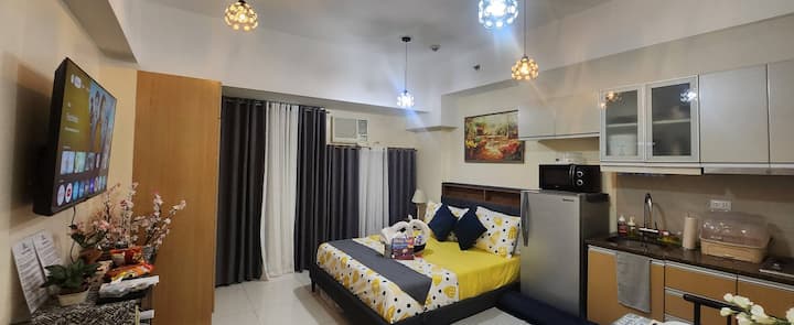 Rest and recharge in ultimate comfort. This inviting bedroom offers a queen bed with fresh, quality linens, ambient lighting, blackout curtains, and a 50-inch smart TV for relaxing evenings.