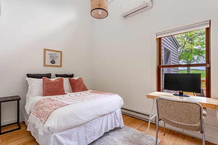 First guest bedroom includes a mini-split and dedicated workspace 