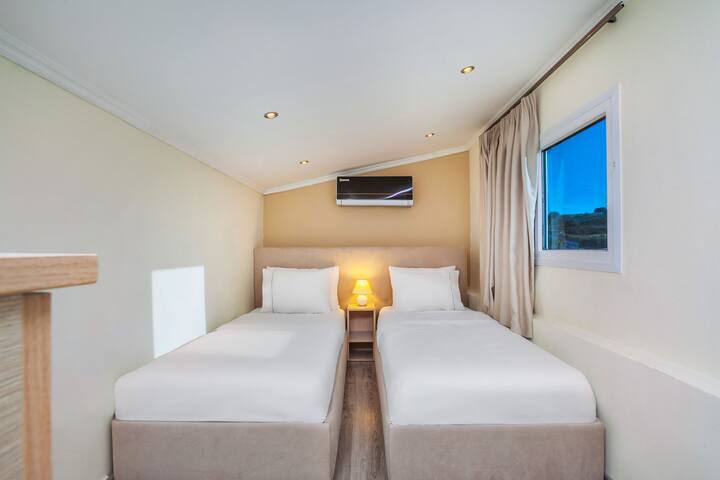 Incantevole camera da letto doppia con letti singoli