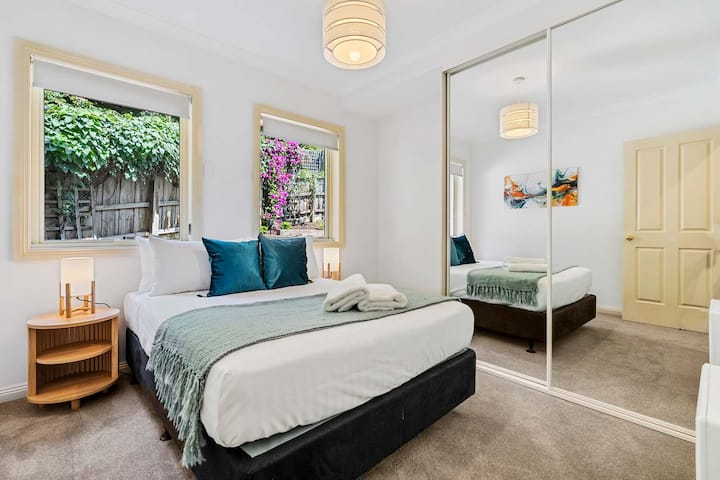 Double bed with a view of the garden.Heating and wardrobe